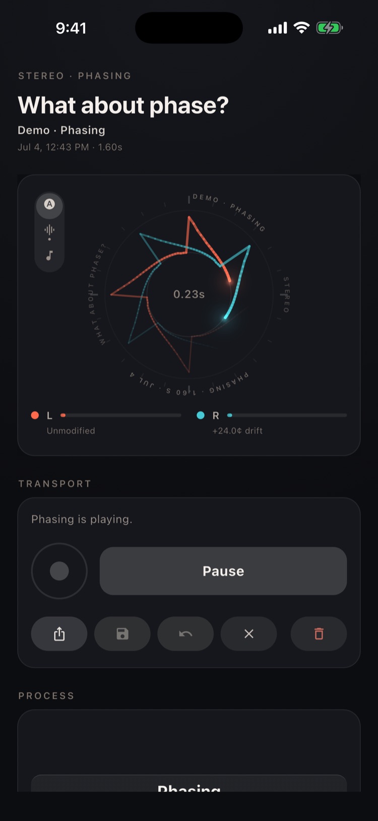 The phasing demo playing: two spiky rings, coral and cyan, drifting on the wheel display